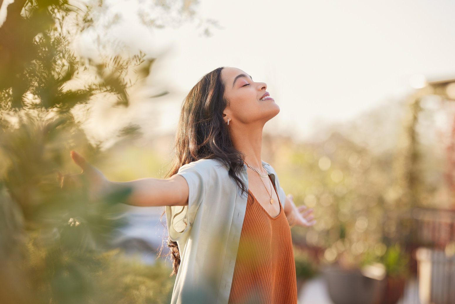 Serene latin woman enjoy sunset with gratitude